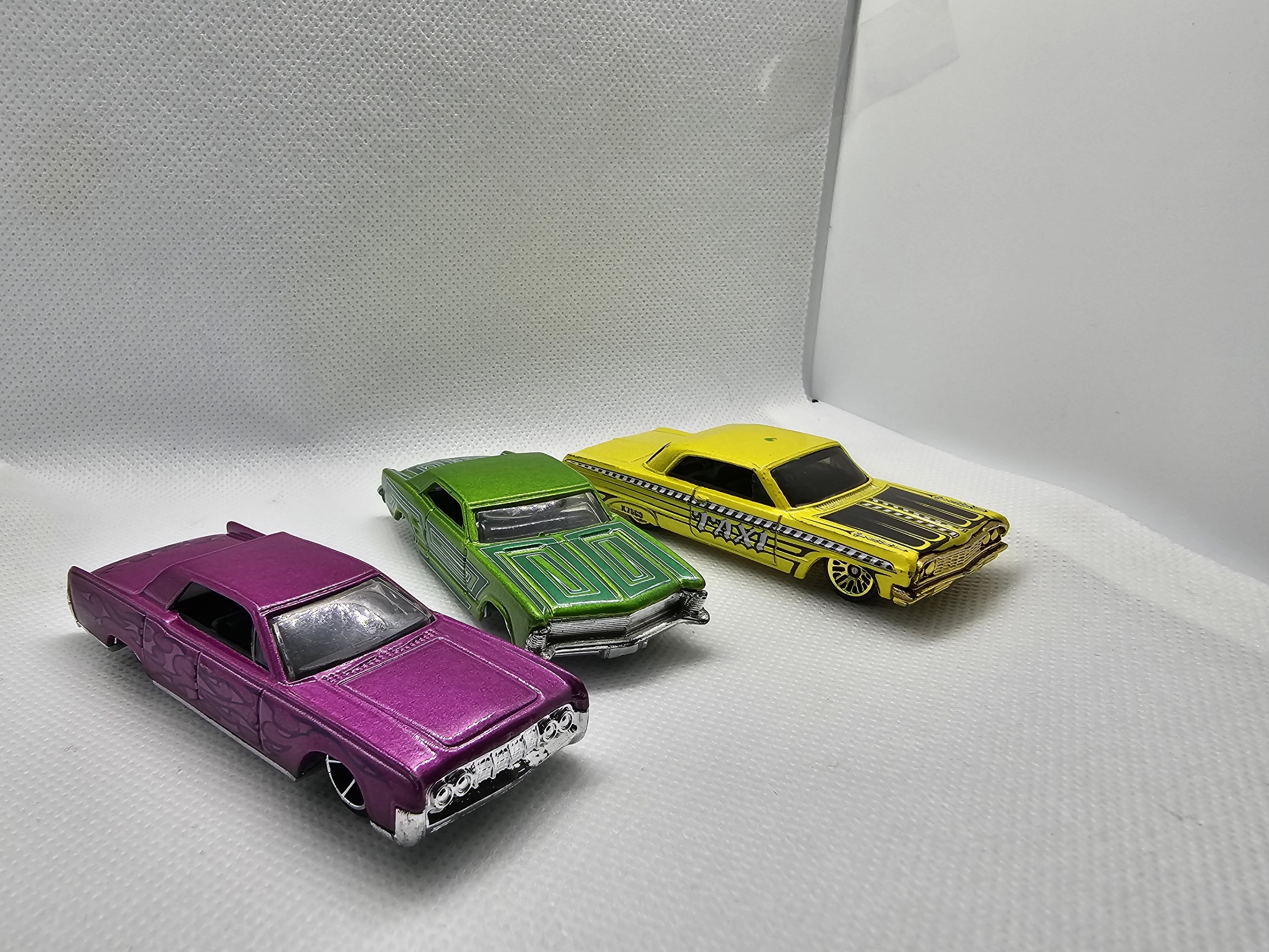 Collection of colorful lowrider toy cars